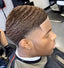 Man applying SPI Styles Wave Pomade to achieve 360 waves
